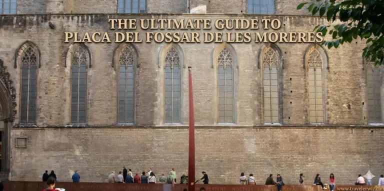 A historic stone building with tall Gothic-style arched windows forms the backdrop, while people sit and gather along a low wall in a public square. A tall red sculpture stands at the center, and large text across the top reads “The Ultimate Guide to Plaça del Fossar de les Moreres.”