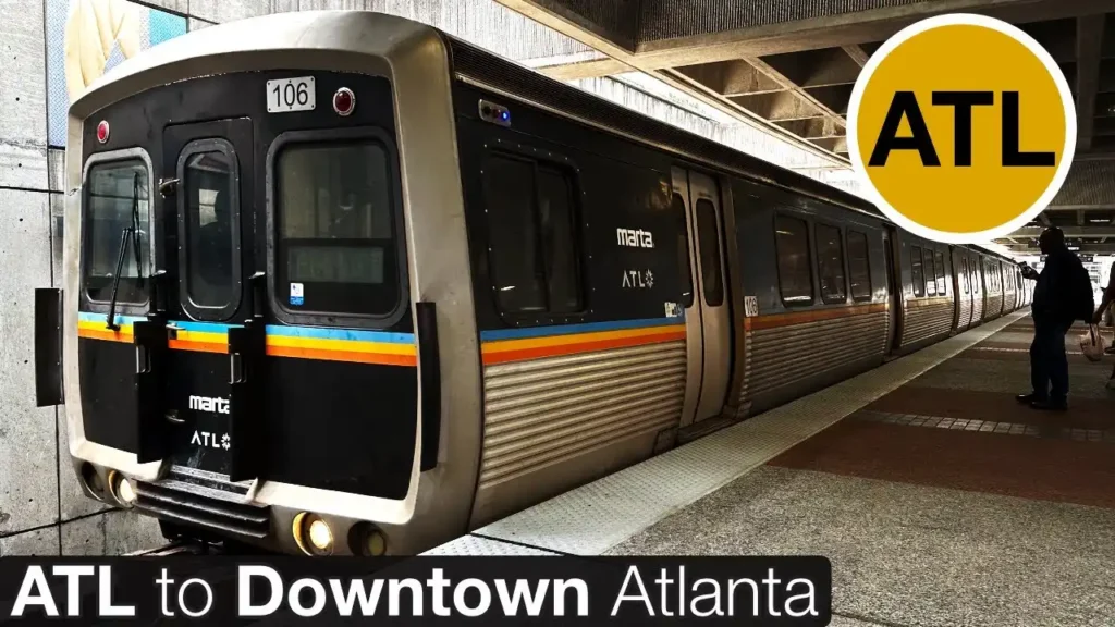 MARTA train at station with ATL sign showing public transport from airport to downtown Atlanta